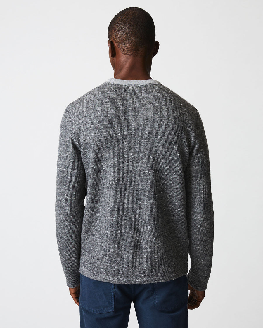 Male model wears the LS Rib Tee in Heather Grey