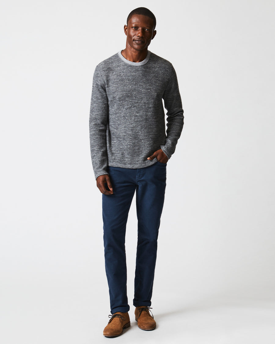 Male model wears the LS Rib Tee in Heather Grey