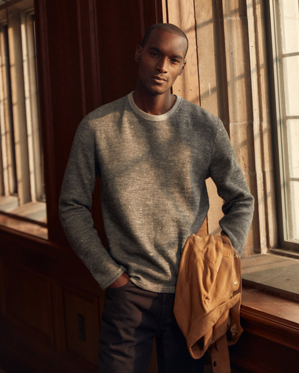 Male model wears the LS Rib Tee in Heather Grey