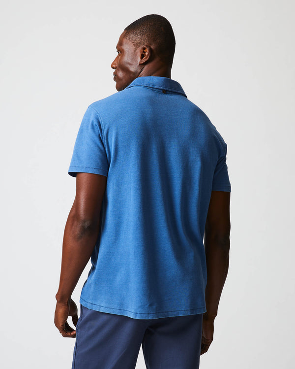 Male model wears the Indigo Polo in Denim 
