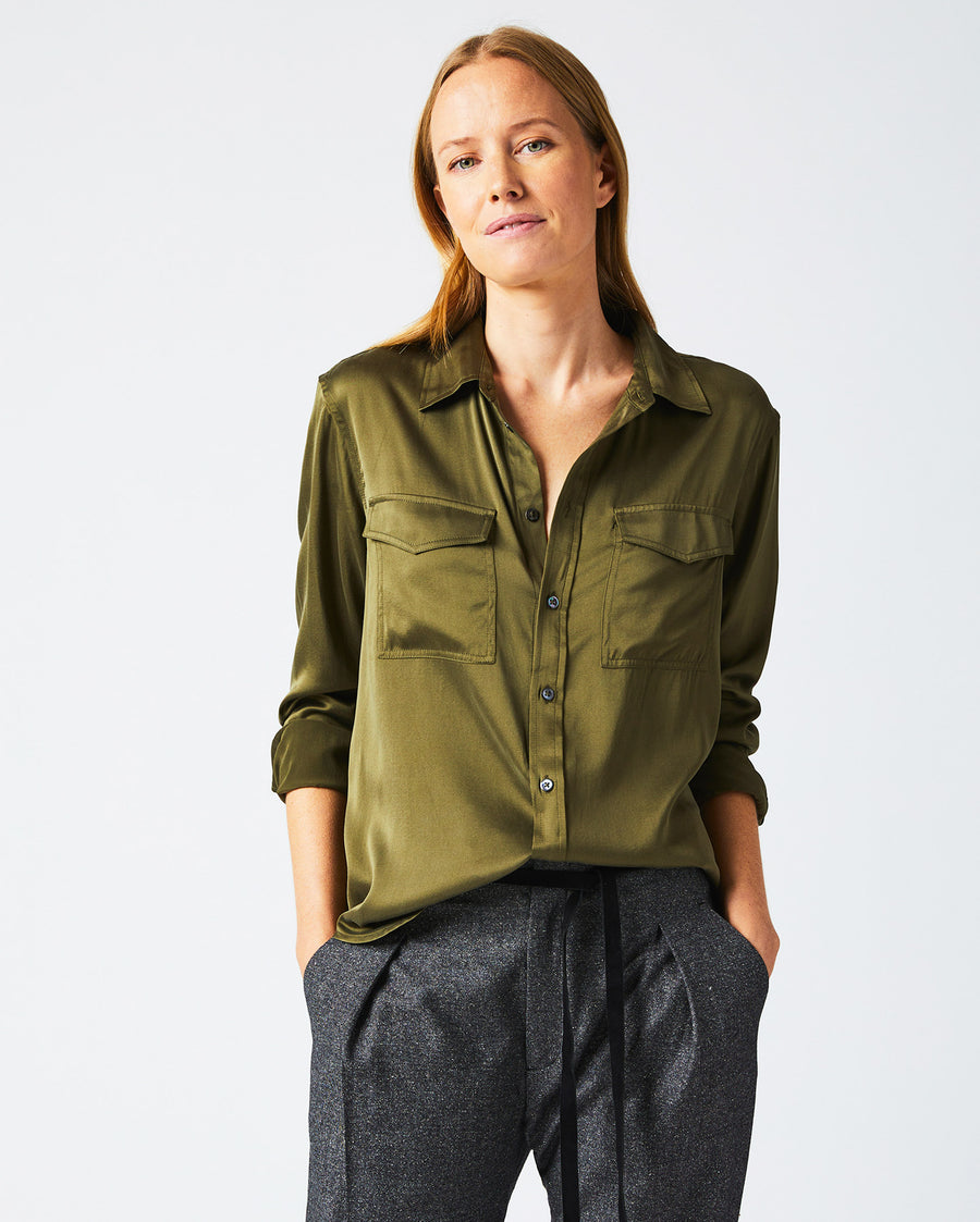Female model wears the utility shirt in burnt olive