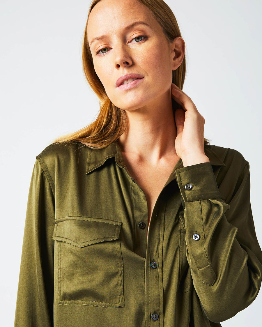 Female model wears the utility shirt in burnt olive