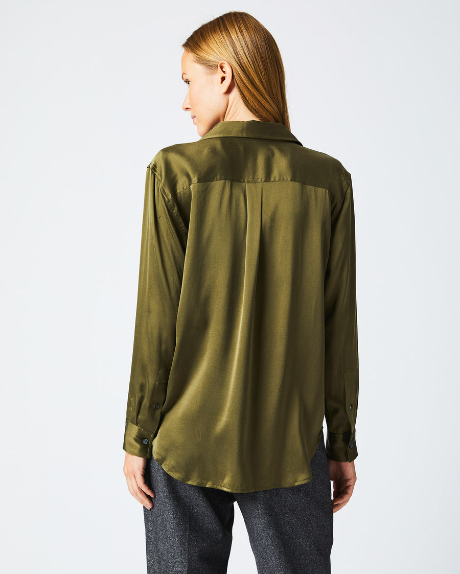 Female model wears the utility shirt in burnt olive