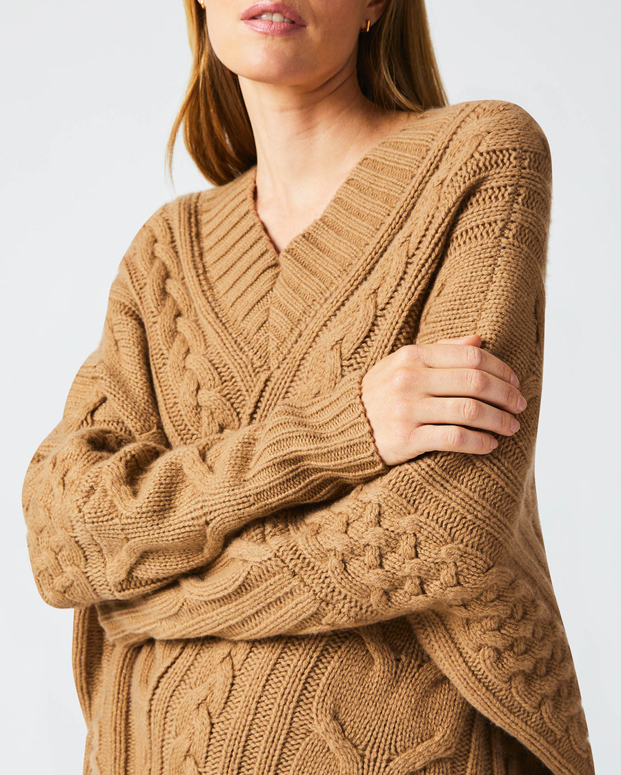 Female model wears the Bias Cable Sweater in Camel