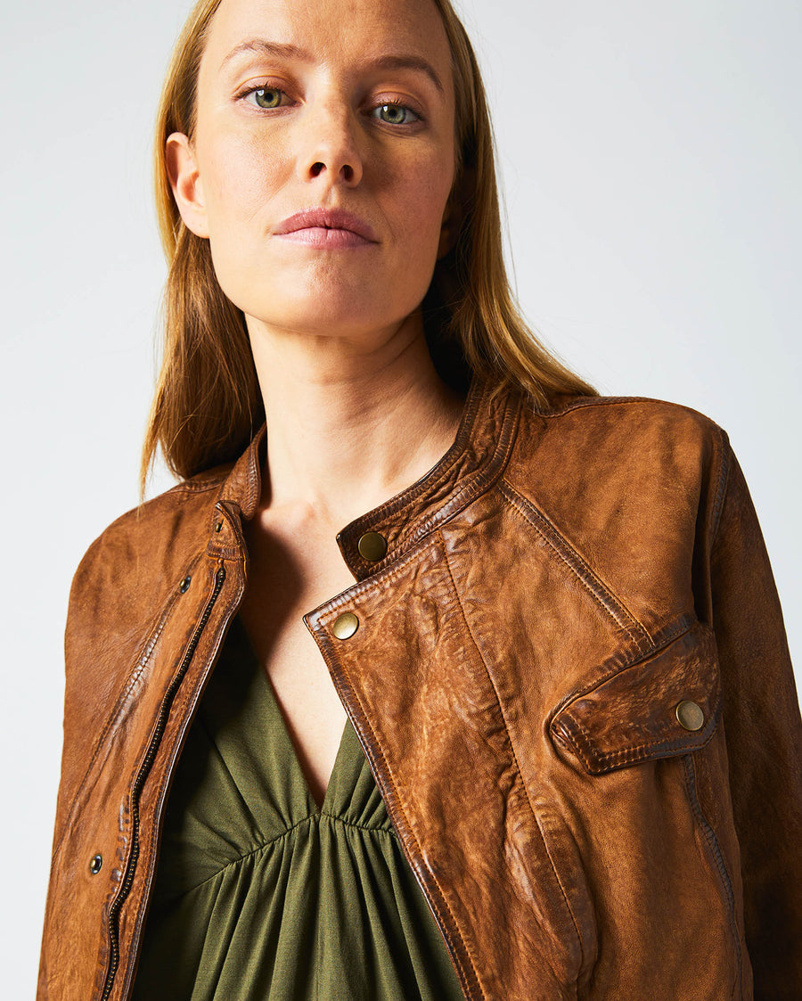 Female model wears the Biker Jacket in Brown