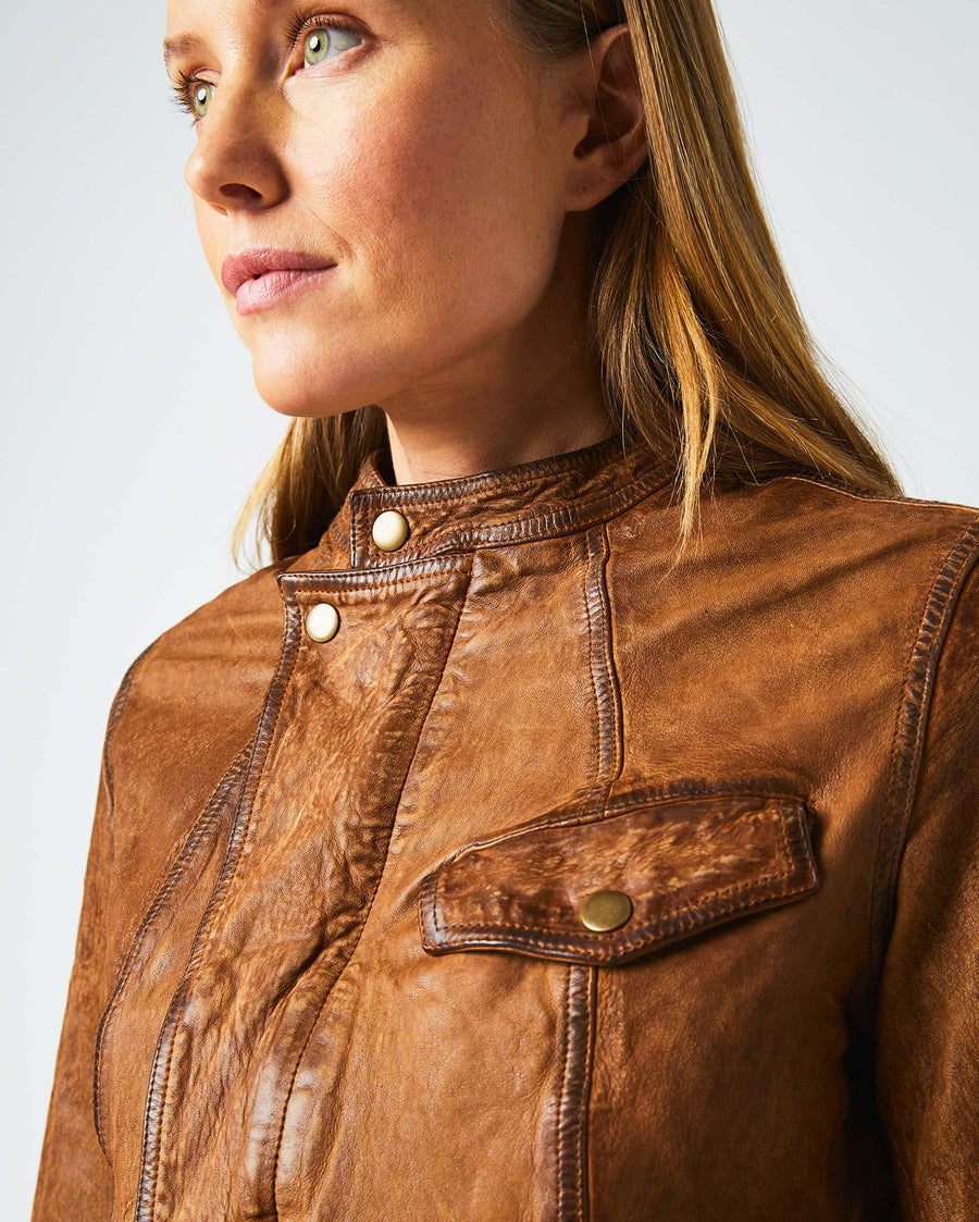 Female model wears the Biker Jacket in Brown