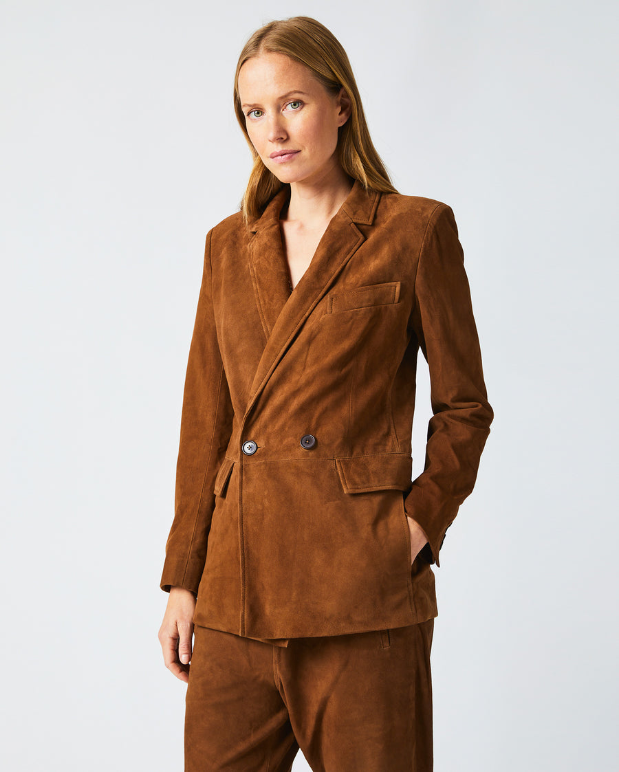 Female model wears the Suede Blazer in Cognac