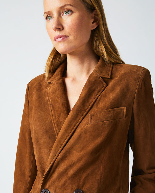Female model wears the Suede Blazer in Cognac