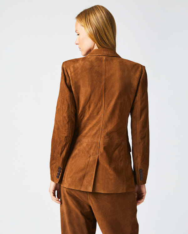 Female model wears the Suede Blazer in Cognac