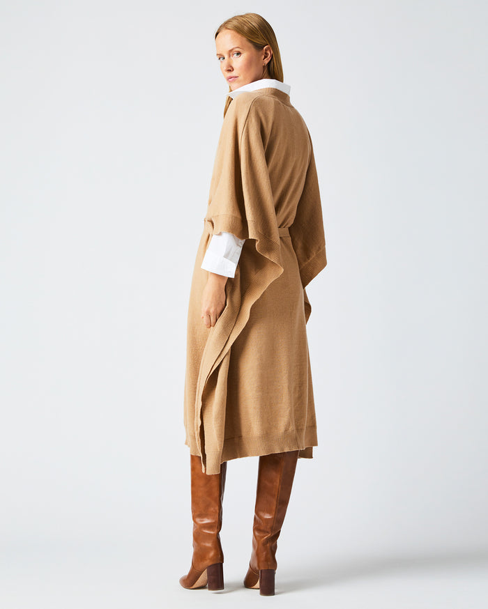 Female model wears the Poncho Sweater Dress in Camel