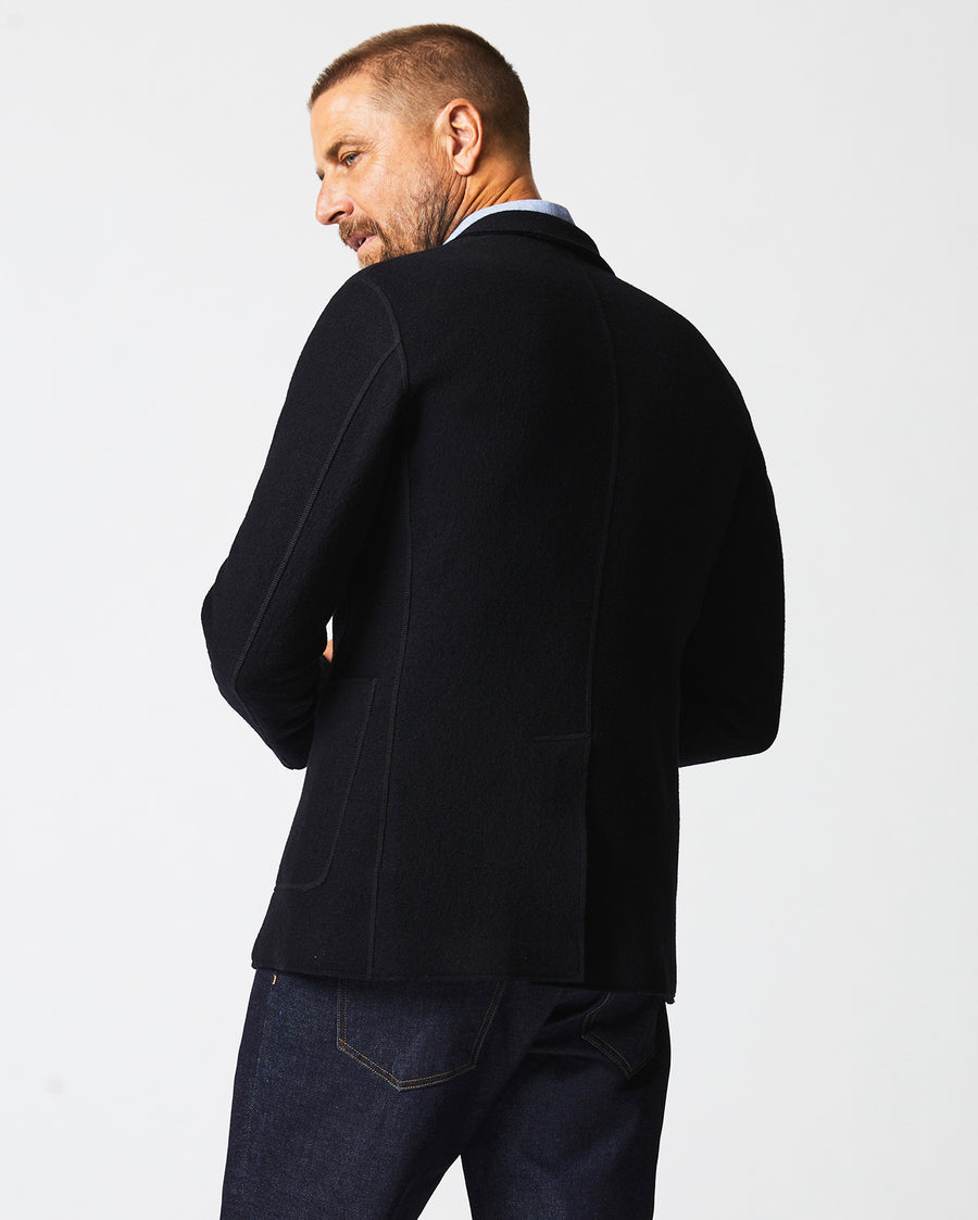 Male model wears the Boiled Wool Sport Coat in Black