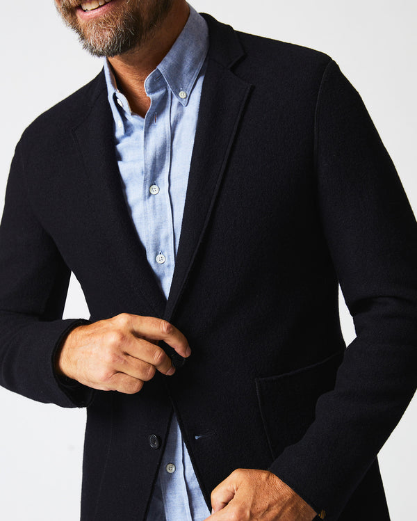 Male model wears the Boiled Wool Sport Coat in Black