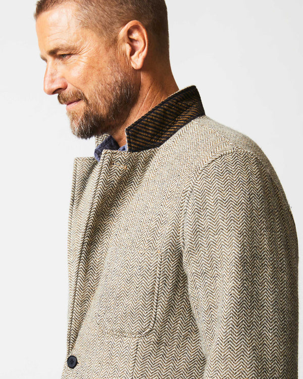 Male model wears Herringbone Leo Jacket in Brown
