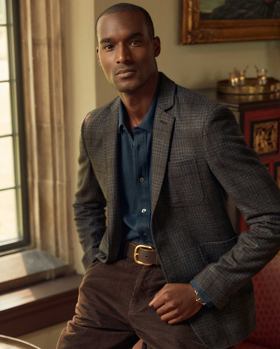 Male model wears the Archie Jacket in Dark Brown