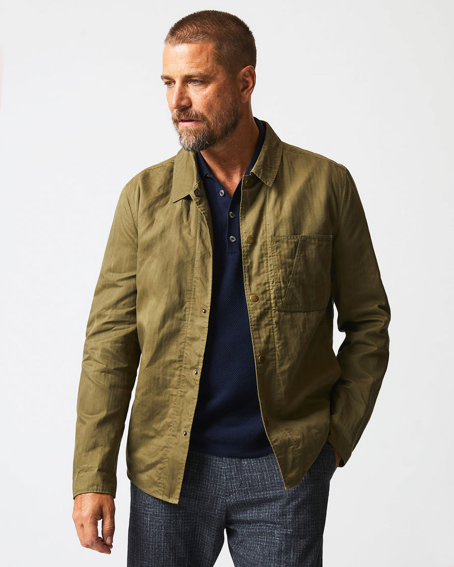 Male model wears the Leroy Shirt Jacket in Moss Green