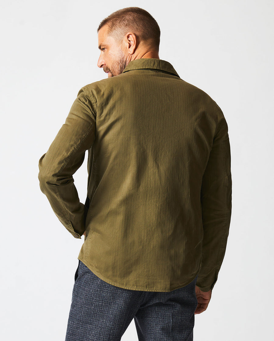 Male model wears the Leroy Shirt Jacket in Moss Green