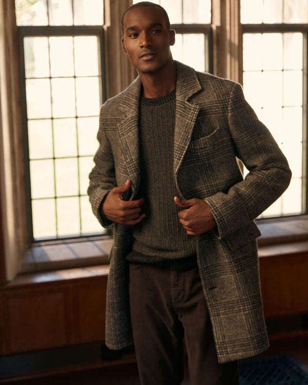 Male model wears the Astor Coat in Charcoal