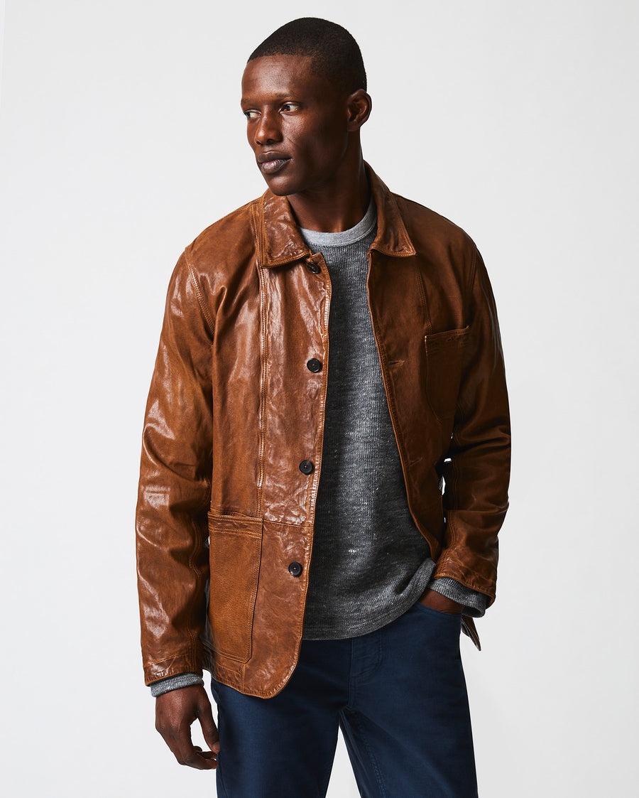 Male model wears the Leather Chore Coat in Cognac