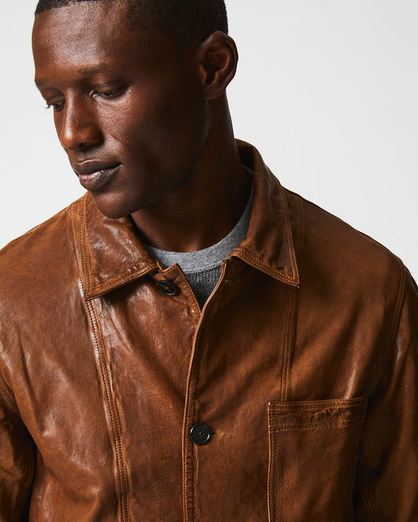 Male model wears the Leather Chore Coat in Cognac
