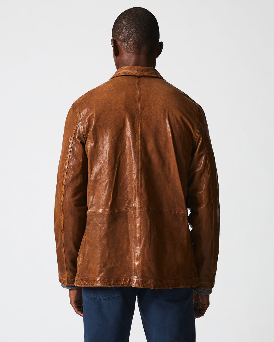Male model wears the Leather Chore Coat in Cognac