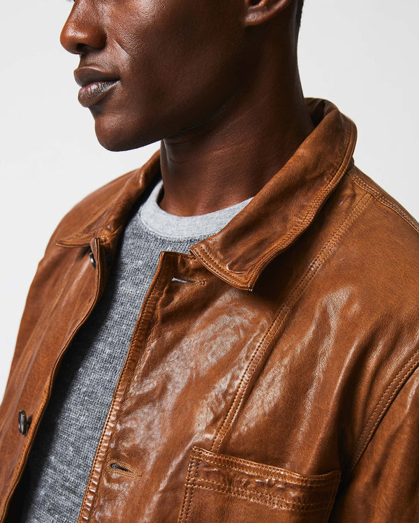 Male model wears the Leather Chore Coat in Cognac