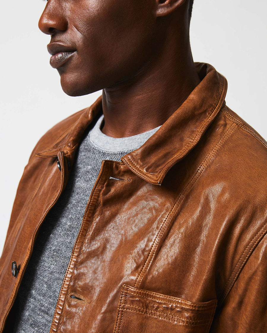 Male model wears the Leather Chore Coat in Cognac