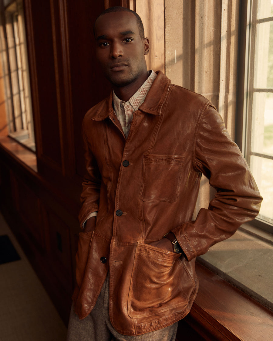 Male model wears the Leather Chore Coat in Cognac