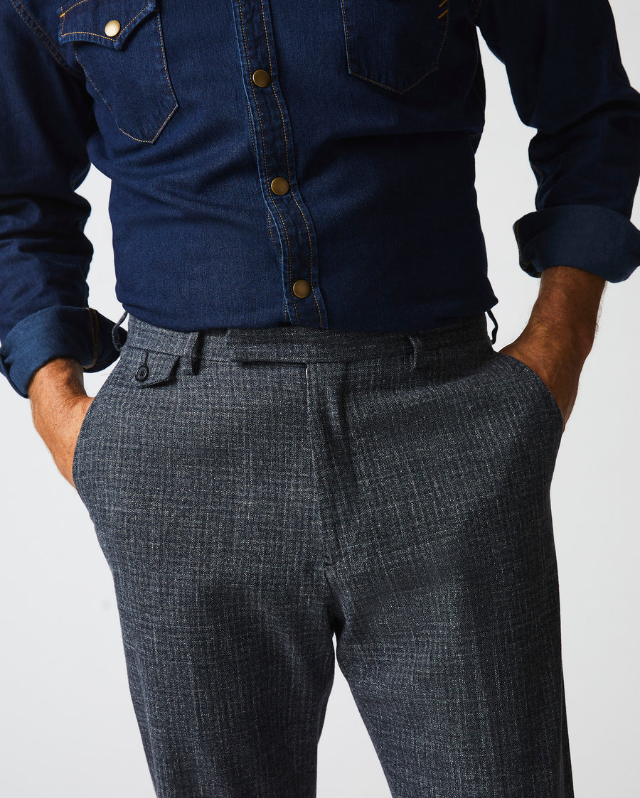 Male model wears the Flat Front Trouser in Charcoal