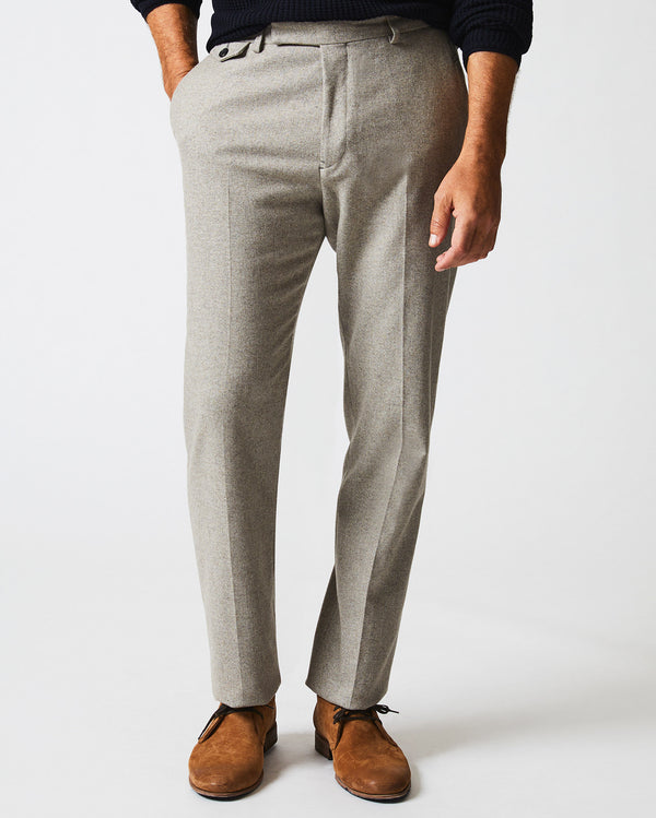 Male model wears the Flat Front Trouser in Grey