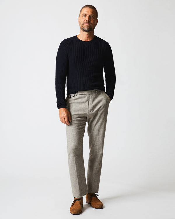 Male model wears the Flat Front Trouser in Grey