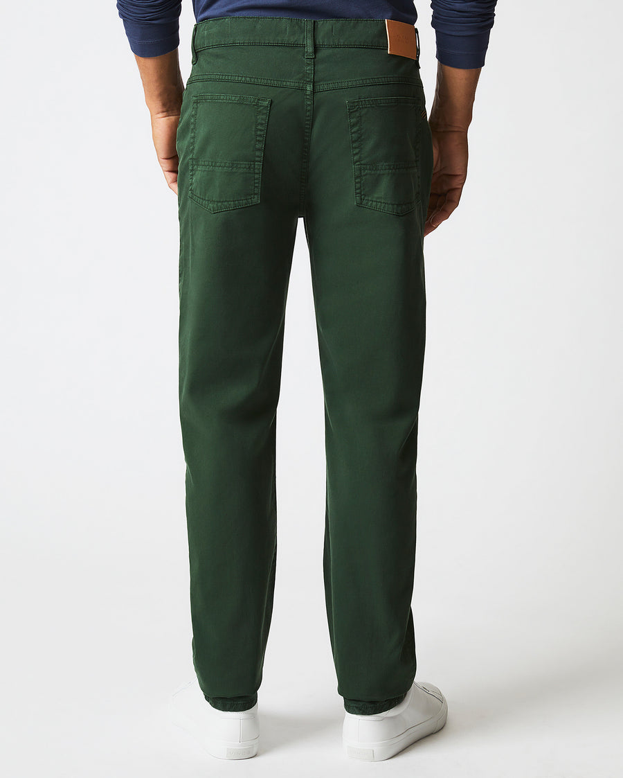 Male model wears the 5 Pocket Pant in Pine Green