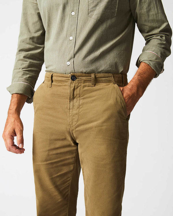 Male model wears the Canvas Chino Pant in Moss Green