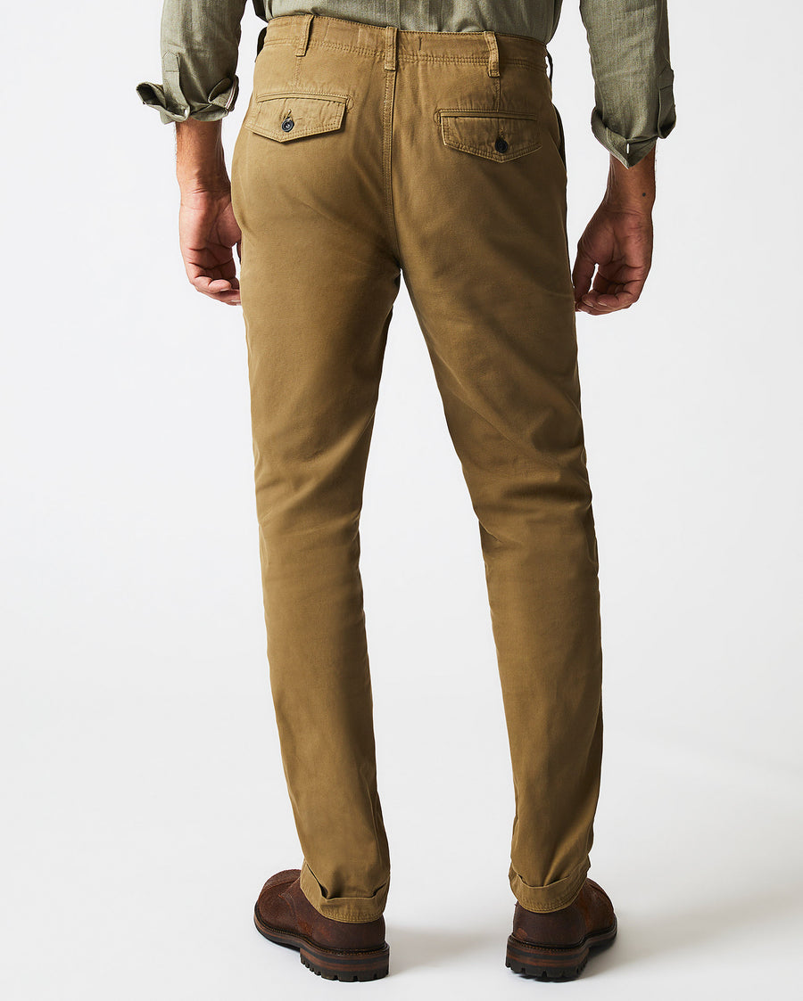 Male model wears the Canvas Chino Pant in Moss Green