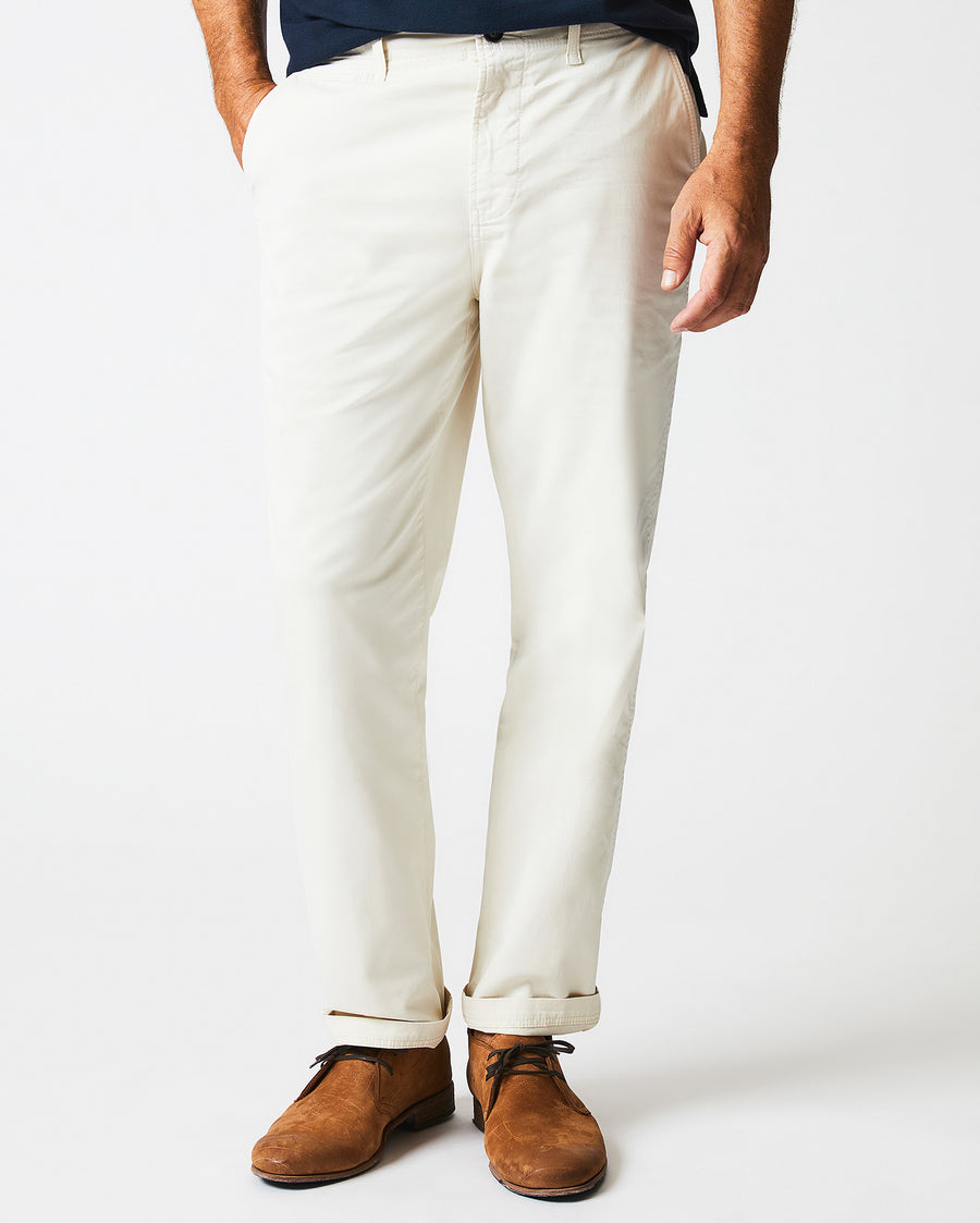 Male model wears the Chino Pant in  Eggshell