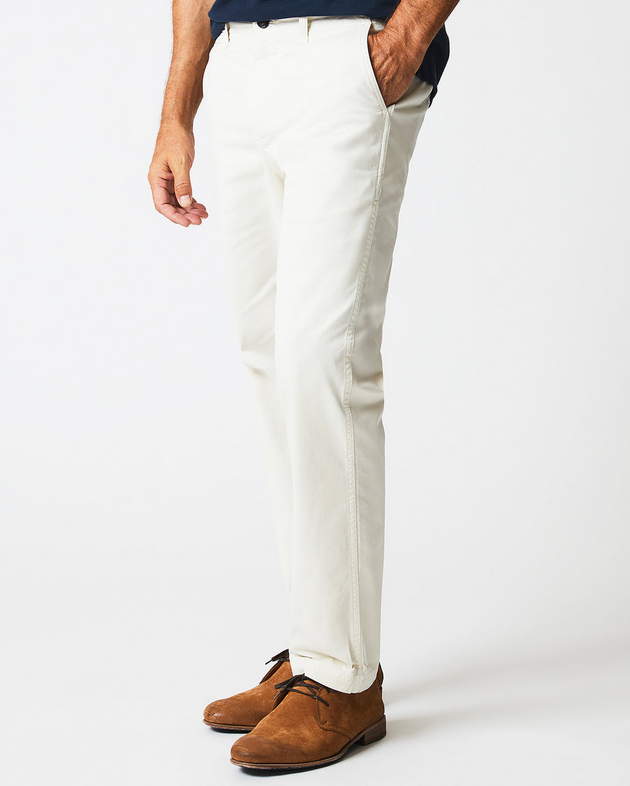 Male model wears the Chino Pant in  Eggshell