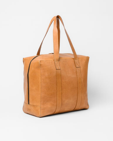 Moore & Giles; image of model carrying Moore and Giles bag