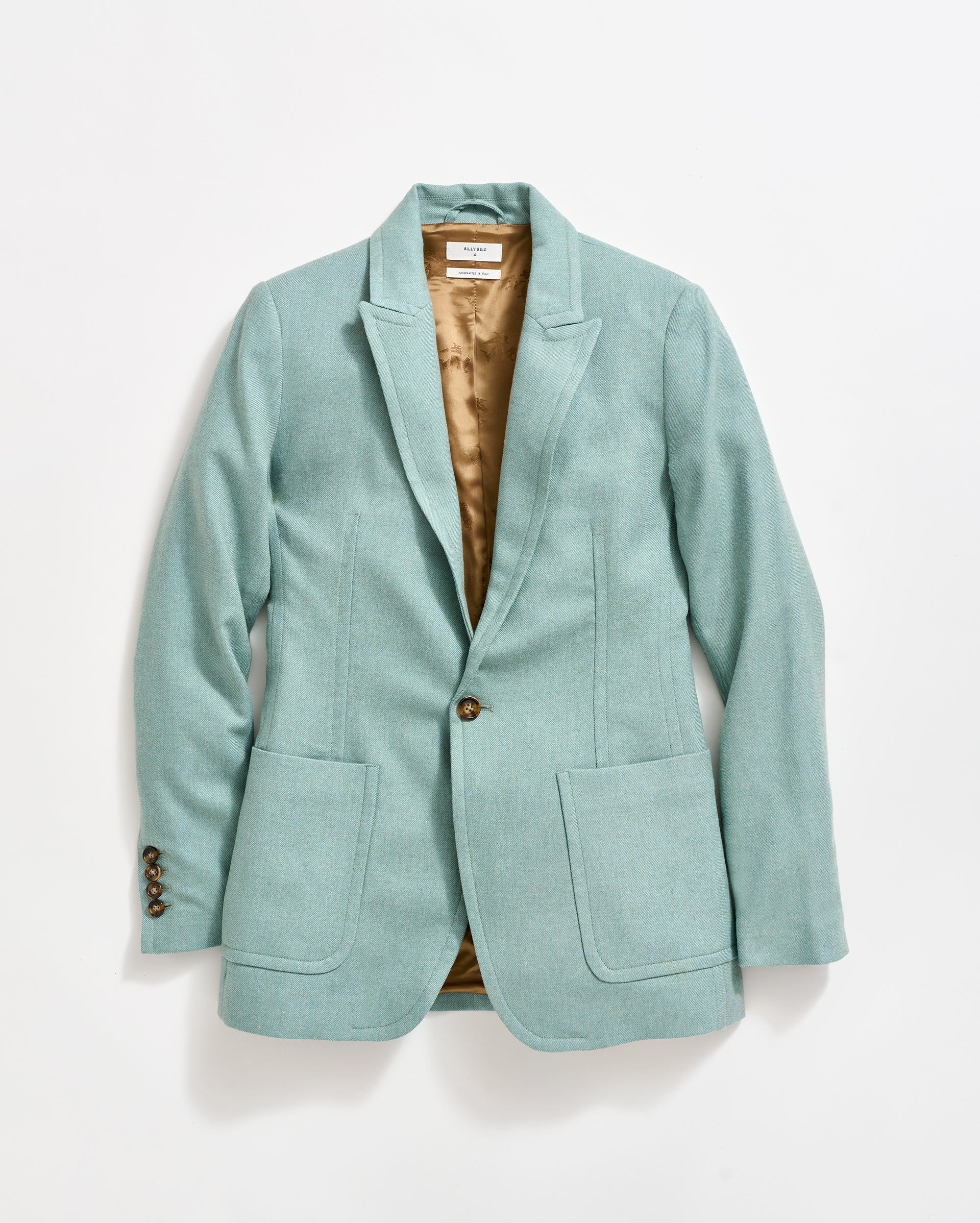 A light teal single-breasted blazer with two front pockets, brown interior lining, and brown buttons on the sleeve and front, displayed on a white background.