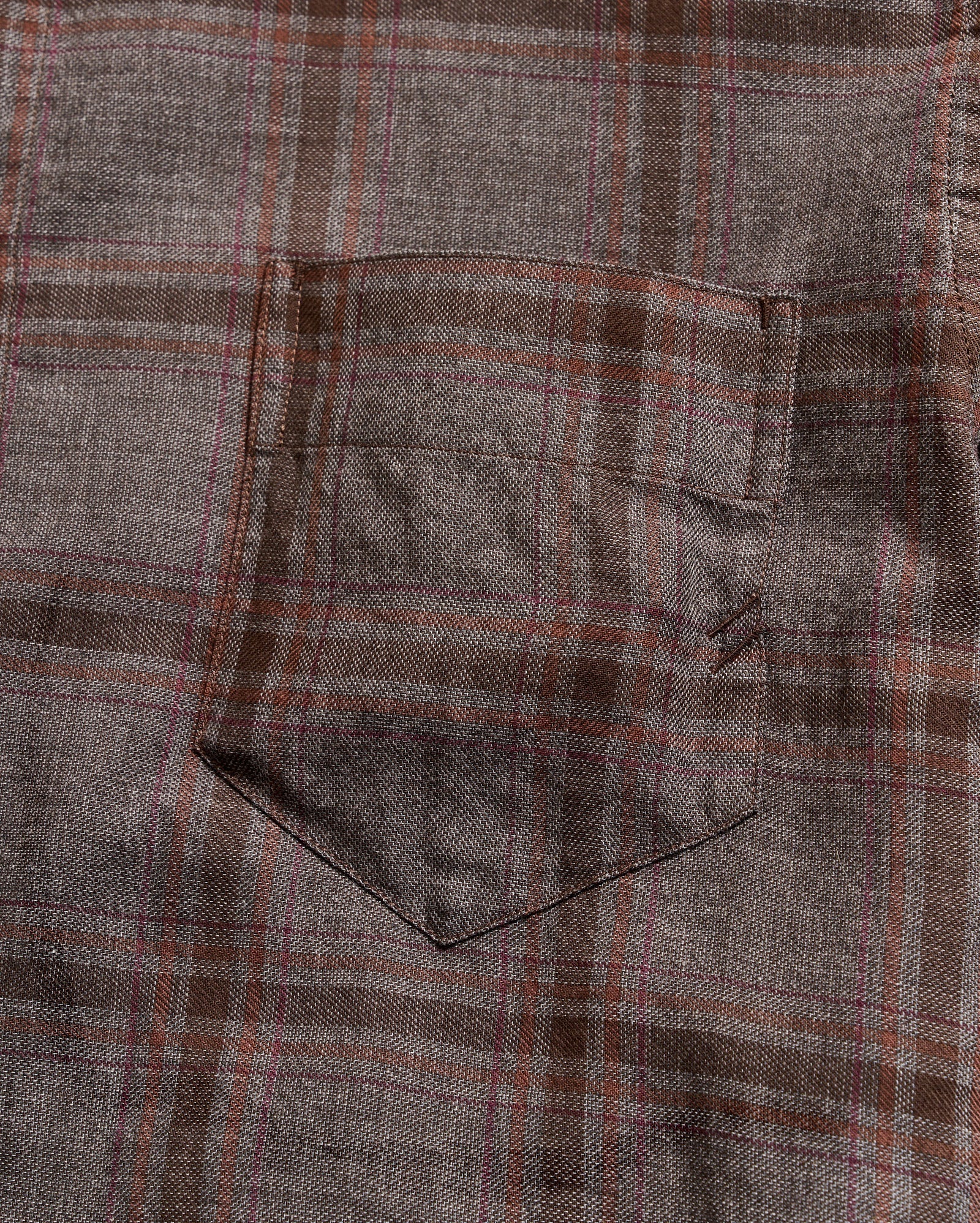 Close-up of a plaid fabric with brown and gray pattern