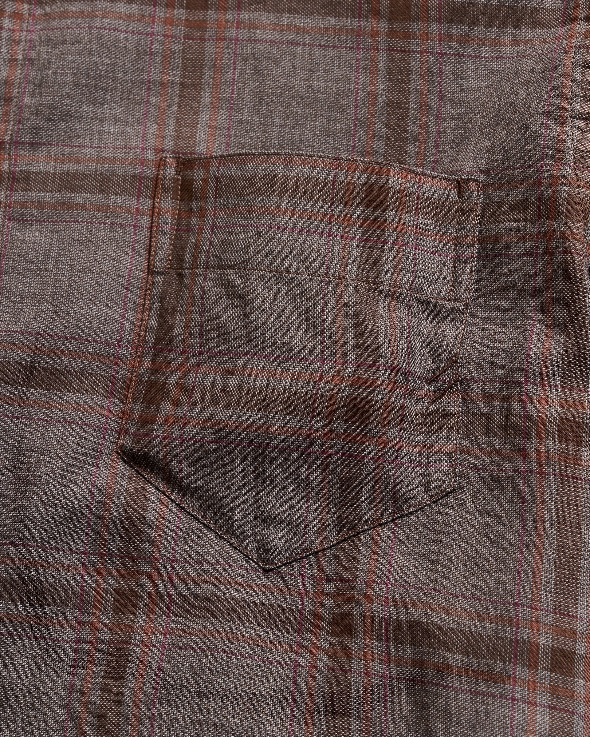 Close-up of a plaid fabric with brown and gray pattern