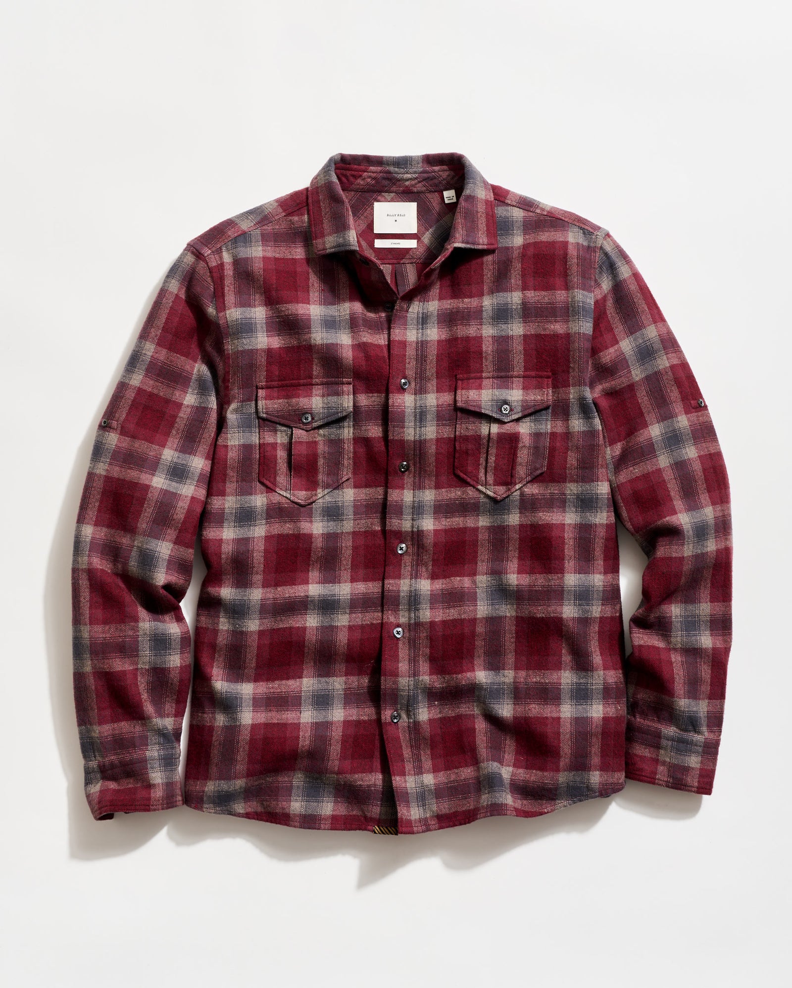 Red and gray plaid shirt on a white background