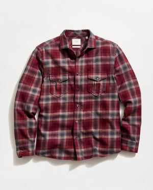 Red and gray plaid shirt on a white background