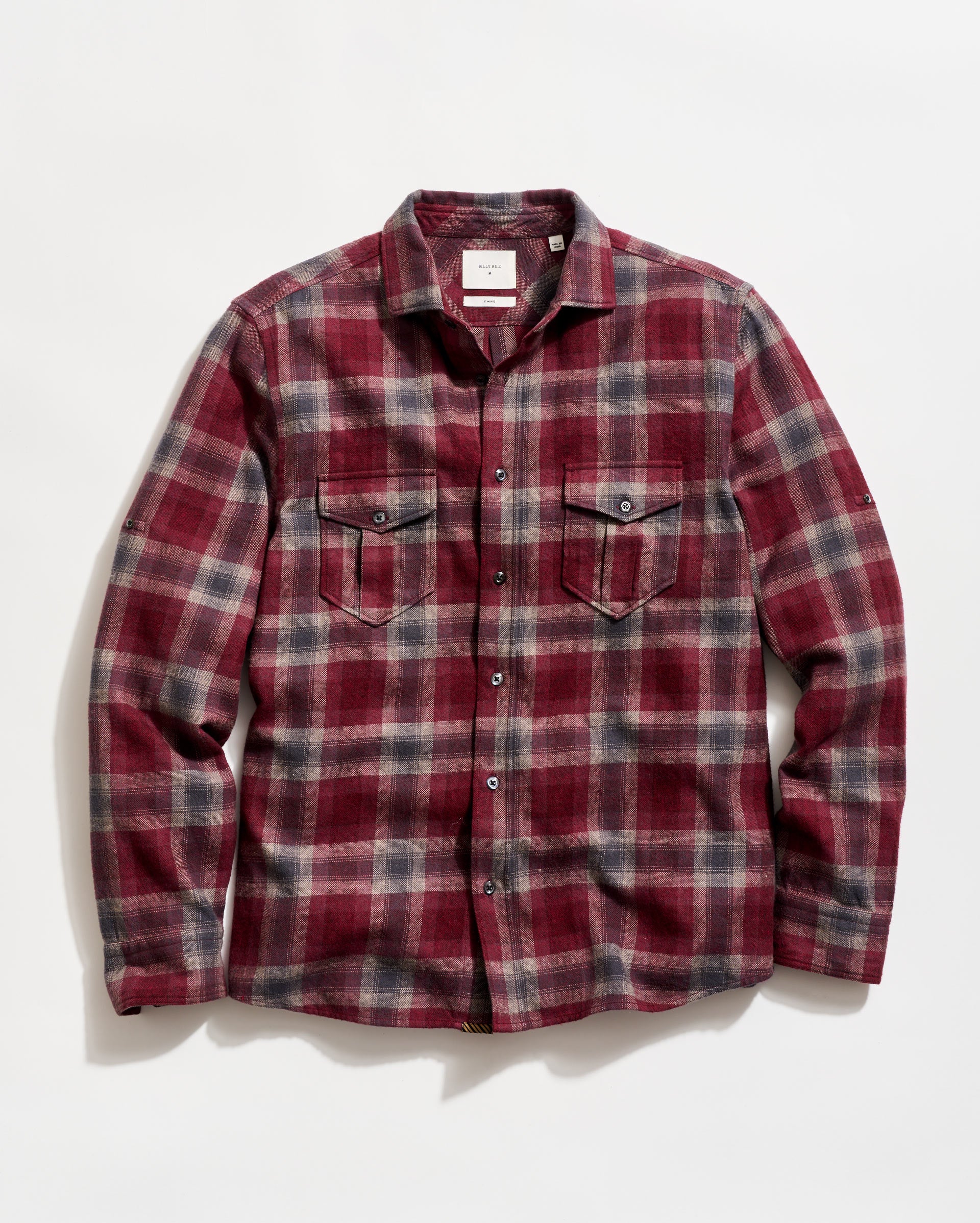 Red and gray plaid shirt on a white background