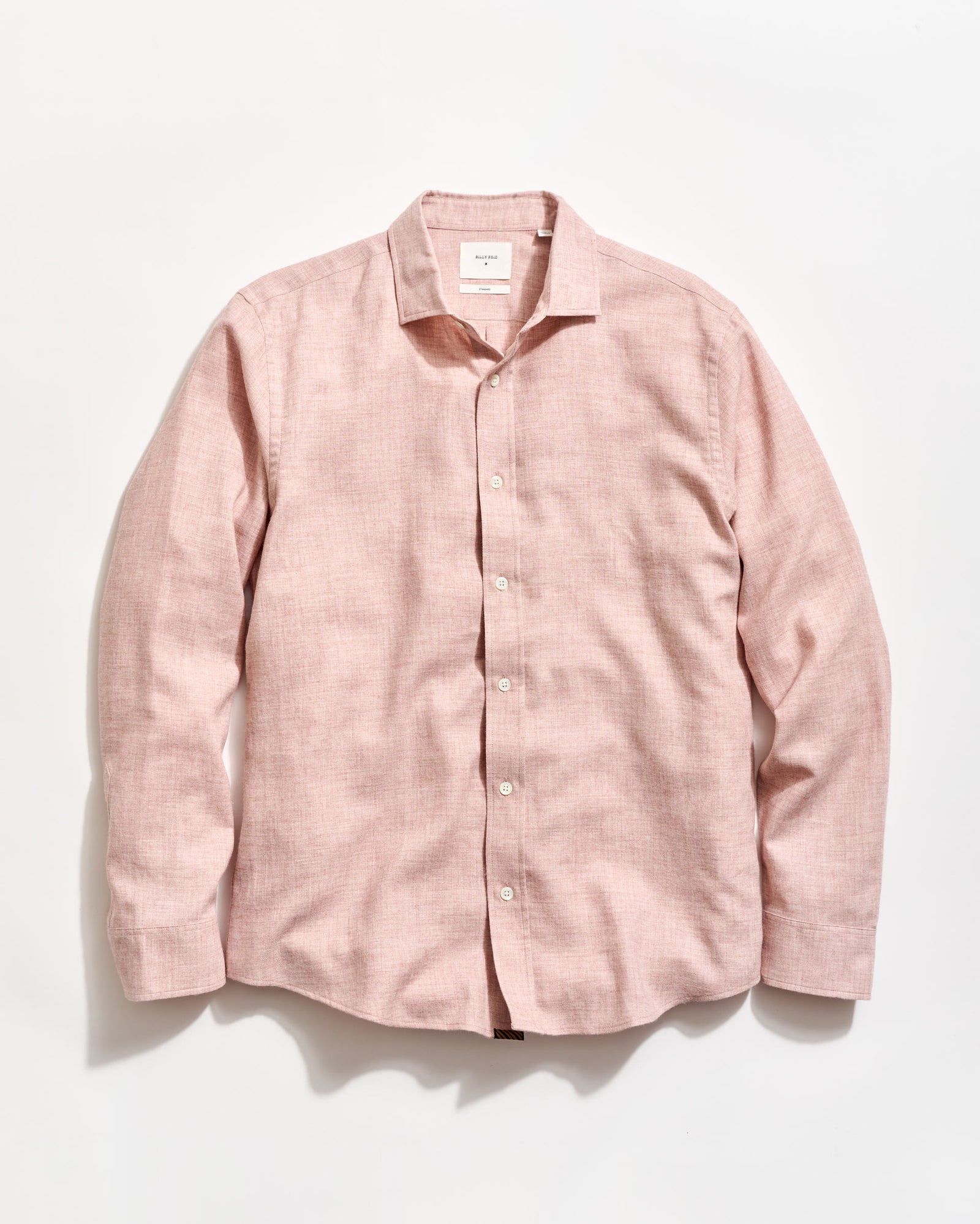 Pink shirt on a light gray background