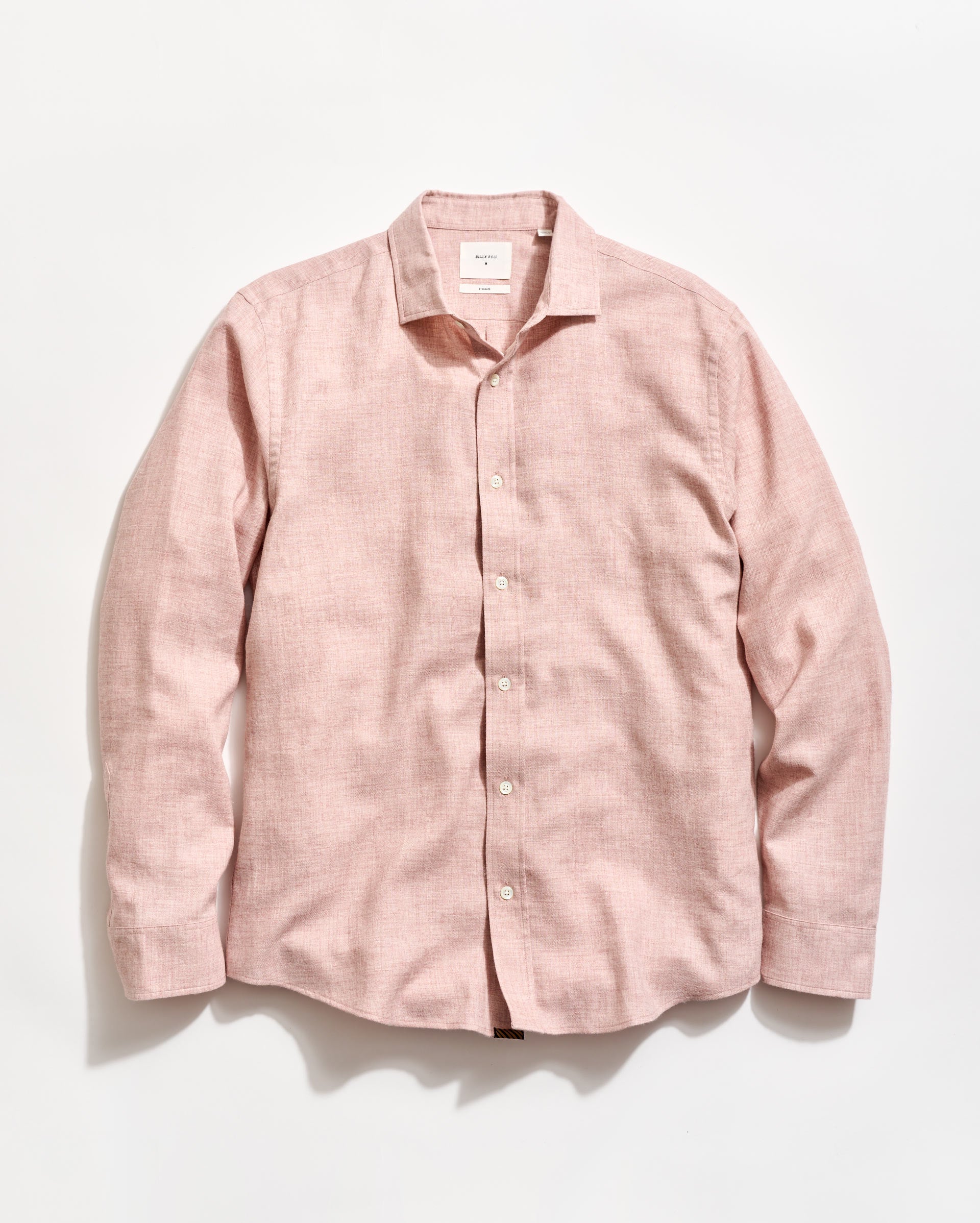 Pink shirt on a light gray background