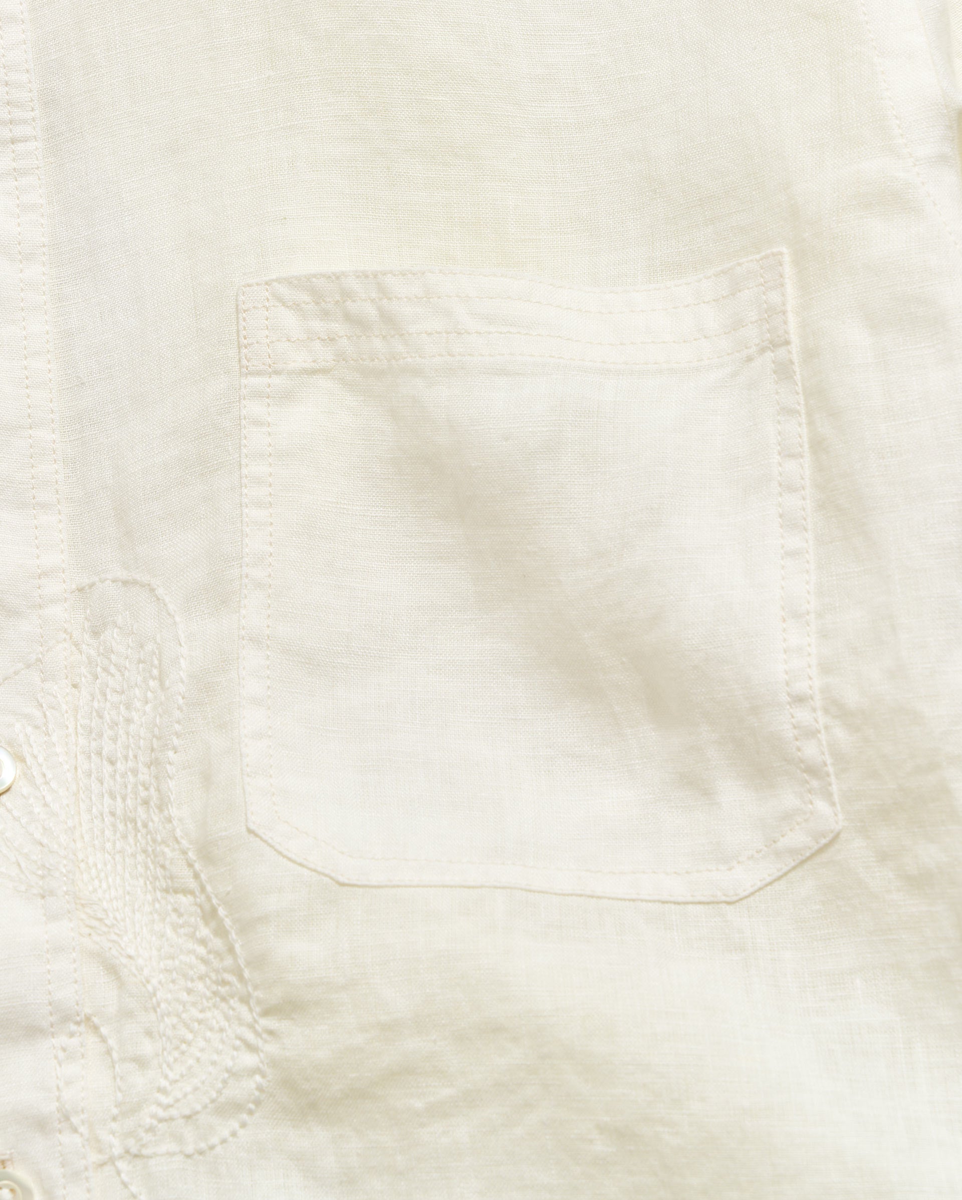 Close-up of a light-colored fabric texture