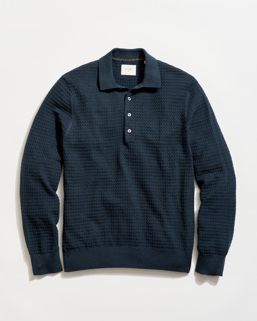 Dark blue textured sweater on a light background
