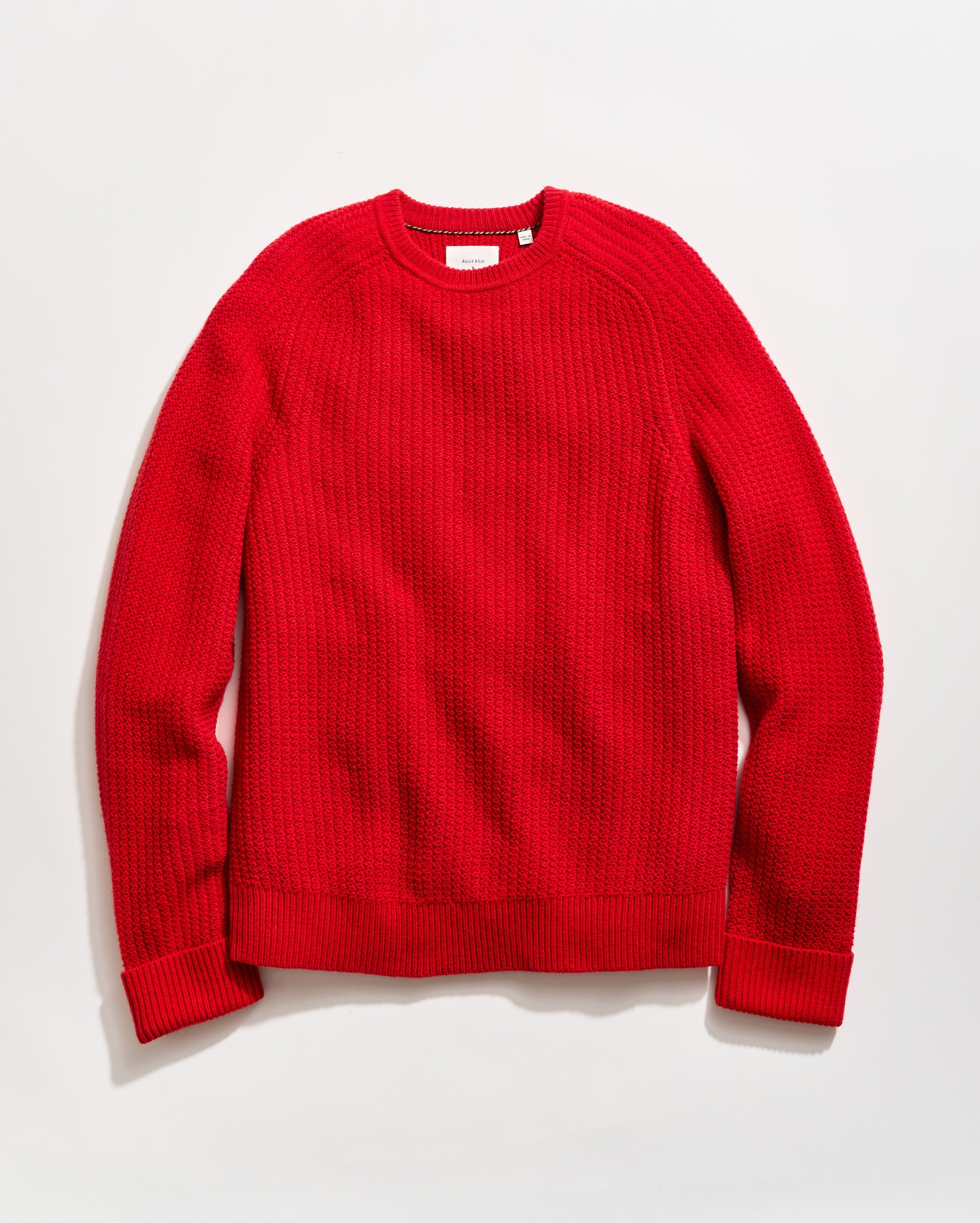 Red sweater on a light gray background