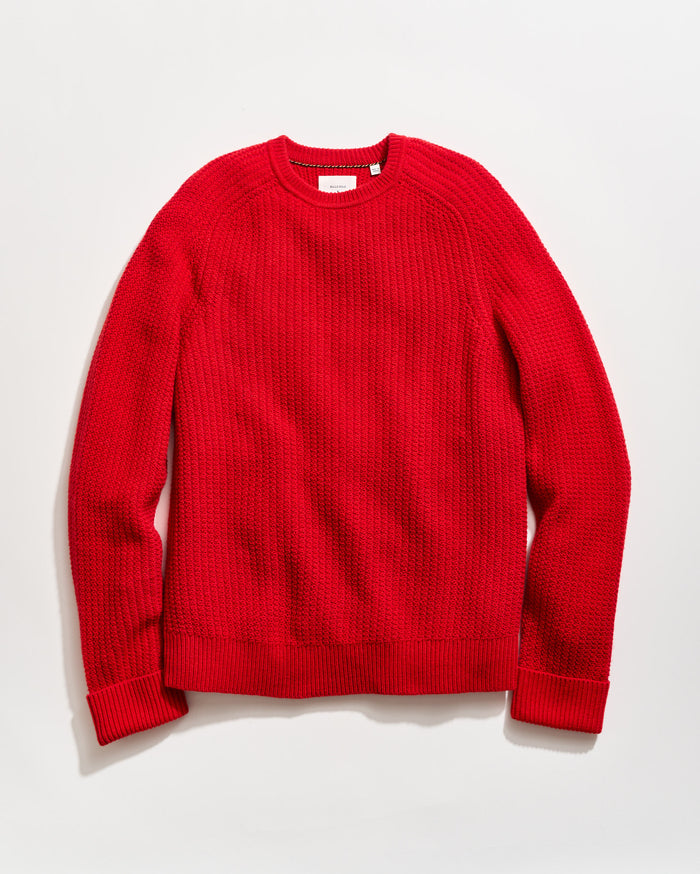 Red sweater on a light gray background