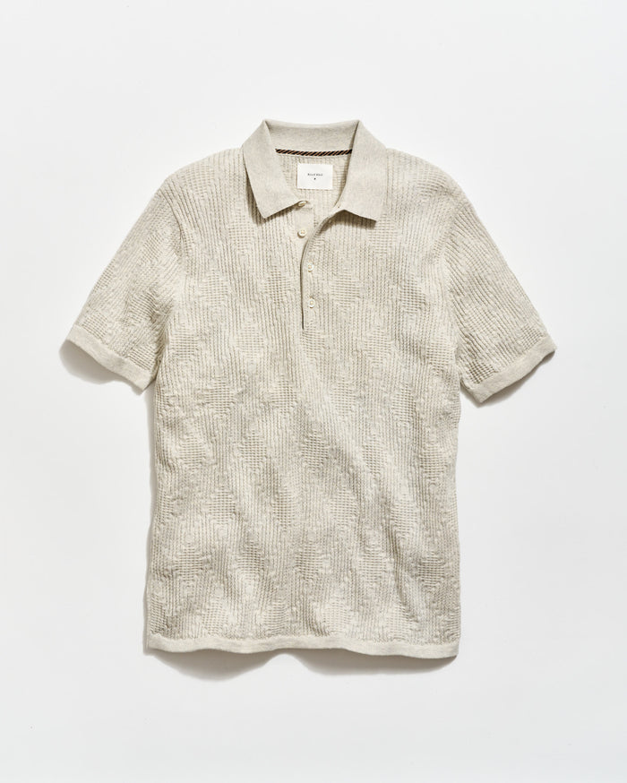 Beige short-sleeve polo shirt on a white background
