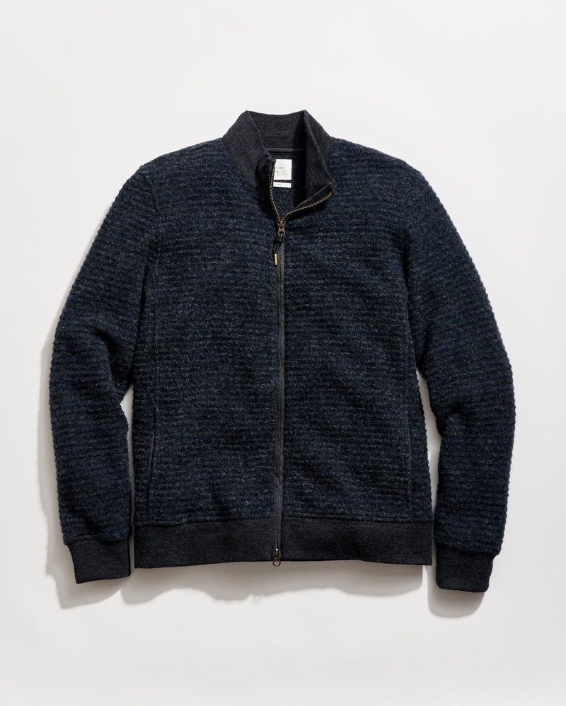 Dark blue zip-up sweater on a light gray background
